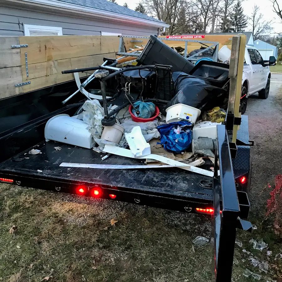 Roll-off dumpster delivered to a residential driveway in Bay Minette